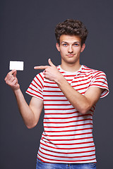 Image showing Man showing empty blank paper card sign