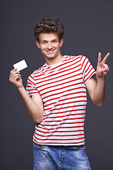 Image showing Man showing empty blank paper card sign