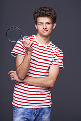 Image showing Smiling man holding magnifying glass