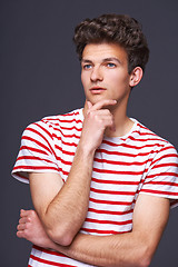 Image showing Thinking man looks up