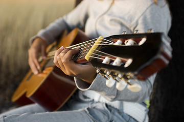 Image showing Playing guitar