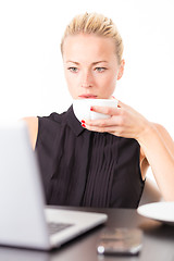 Image showing Business woman with cup of coffee.