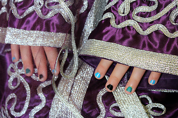 Image showing girl's hands in Moroccan suit