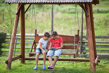 Image showing Children with tablet outdoors