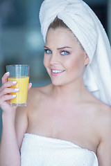 Image showing Woman holding glass of juice