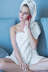 Image showing Woman in Bath Towel Talking on Cell Phone