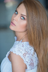 Image showing Beautiful serious young woman with blue eyes