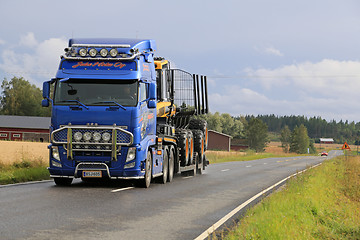 Image showing Volvo FH13 Hauls Ponsse Forwarder on the Road