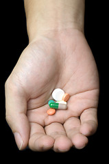 Image showing Hand holding pills

