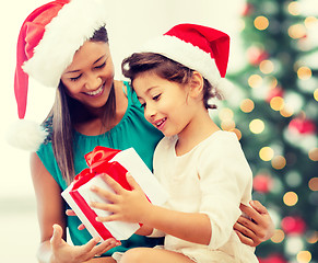 Image showing happy mother and child girl with gift box