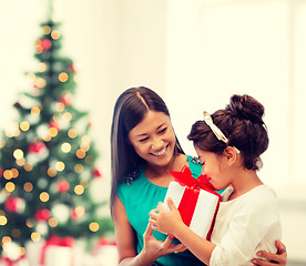 Image showing happy mother and child girl with gift box