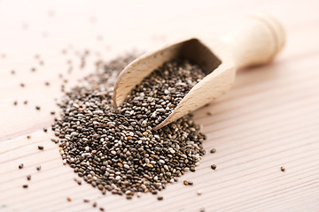 Image showing Nutritious chia seeds on a wooden spoon