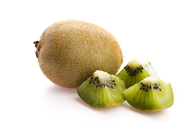 Image showing Whole kiwi fruit and his sliced segments isolated on white backg