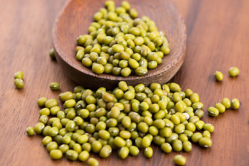 Image showing Mung beans over wooden spoon