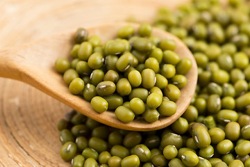 Image showing Mung beans over wooden spoon