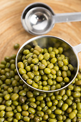 Image showing Mung beans over wooden spoon