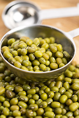 Image showing Mung beans over wooden spoon