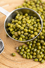 Image showing Mung beans over wooden spoon