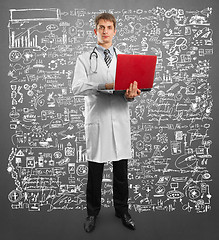 Image showing doctor male in suit with laptop in his hands