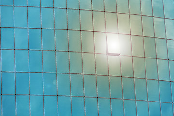 Image showing Solar flare on the window of an office building