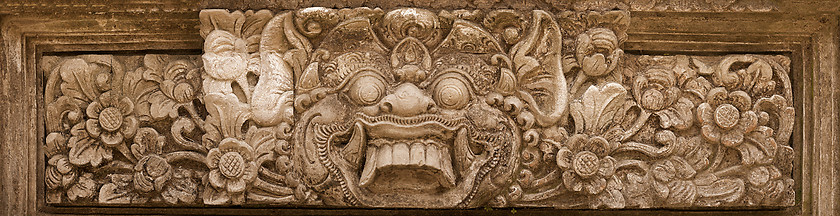 Image showing Horrible mythical monster face. Stone relief from Indonesia, Bal