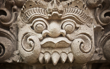 Image showing Face of the ancient deities carved in stone. Indonesia, Bali