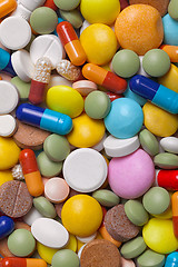 Image showing Pile of colorful medications tablets - medical background