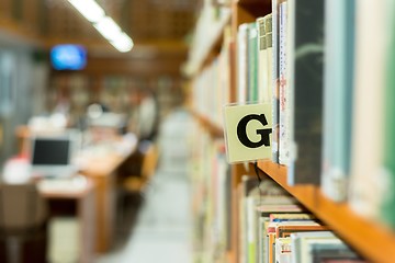 Image showing Library bookshelf closeup with letter