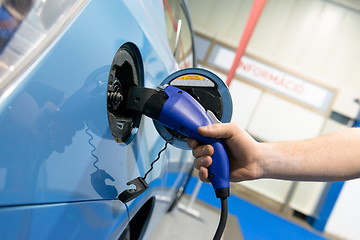 Image showing Electric Car Being Charged at the station