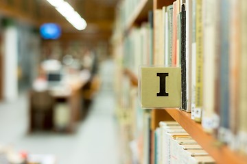 Image showing Library bookshelf closeup with letter