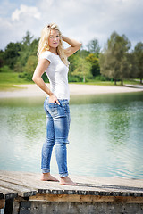 Image showing Blond woman standing on jetty