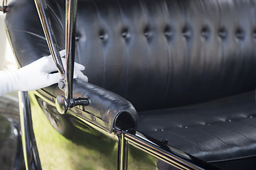 Image showing Female Hand on Leather of Antique Model T Automobile Seat