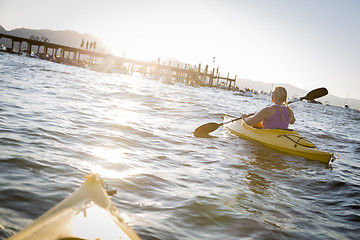 Image showing Woman Kayaking on Beautiful Mountain Lake.