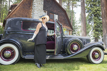 Image showing Attractive Woman in Twenties Outfit Near Antique Automobile