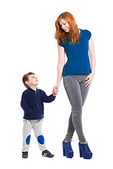 Image showing Pretty smiling woman posing with a little boy