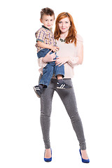 Image showing Redhead woman posing with a little boy