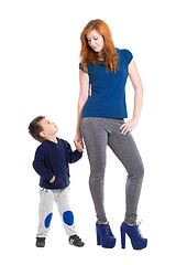 Image showing Young redhead woman with boy