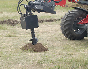 Image showing making a hole