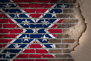 Image showing Dark brick wall with plaster - Confederate flag