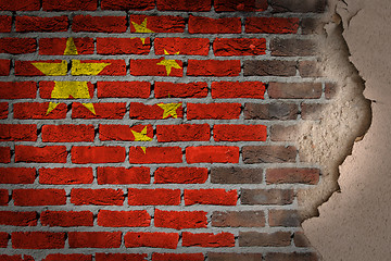 Image showing Dark brick wall with plaster - China