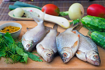 Image showing Fish and components for her preparation: vegetables, spices, par