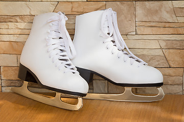 Image showing The female skates and boots of white color for figure skating.