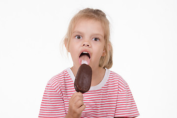 Image showing Five year old girl eating an ice cream