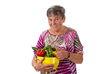 Image showing Senior woman with vegetables