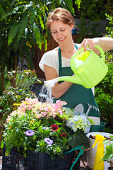 Image showing Young woman gardening outdoor