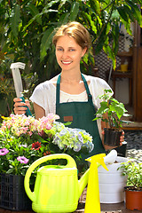 Image showing Young woman gardening outdoor