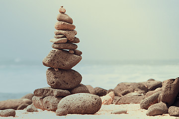 Image showing Close-up of white pebbles stack over sea 
