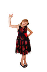 Image showing Girl waiving with her hand.