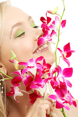 Image showing happy blond with orchid