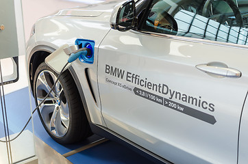 Image showing New model of BMW x5 with hybrid engine at charging station